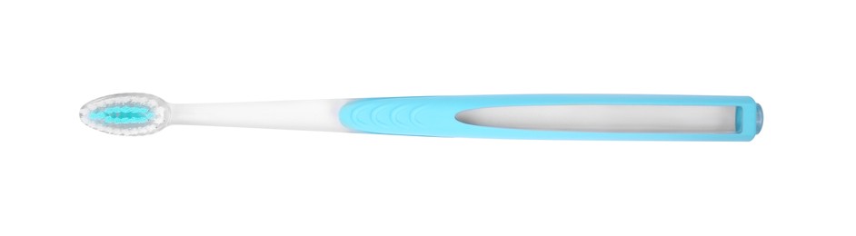 Photo of Light blue plastic toothbrush isolated on white, top view