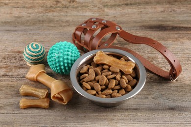 Photo of Different pet goods on wooden table. Shop assortment