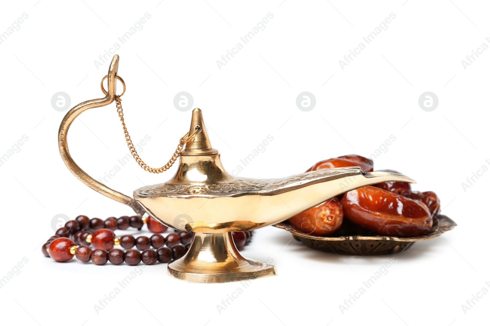 Photo of Aladdin magic lamp, dates and beads on white background