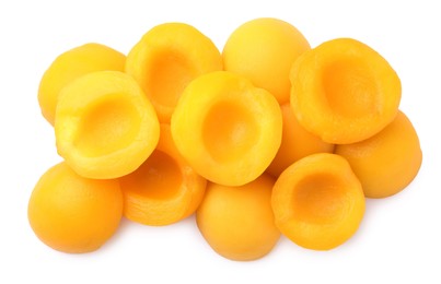 Photo of Sweet juicy canned peach halves isolated on white, top view