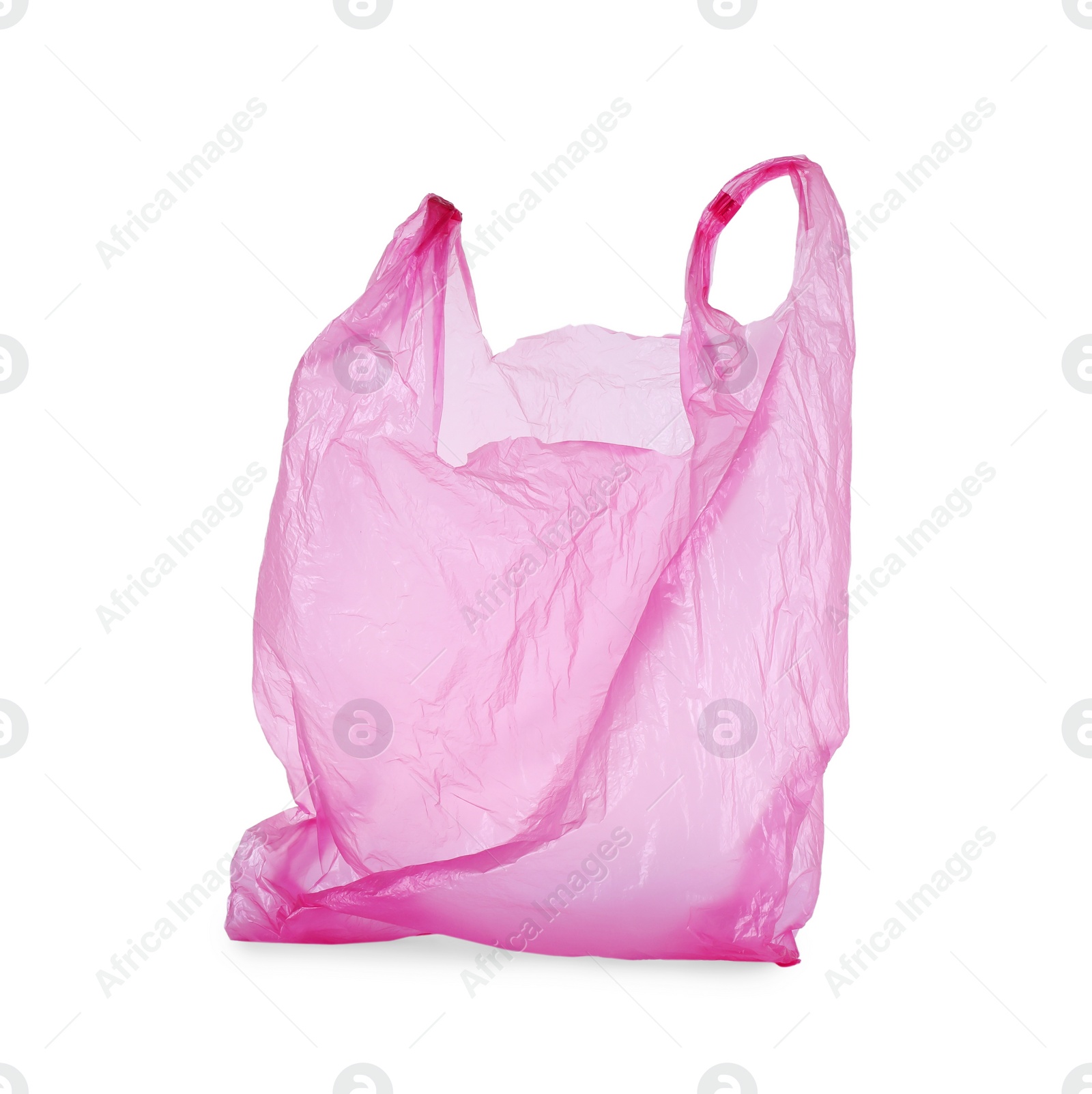 Photo of One pink plastic bag isolated on white