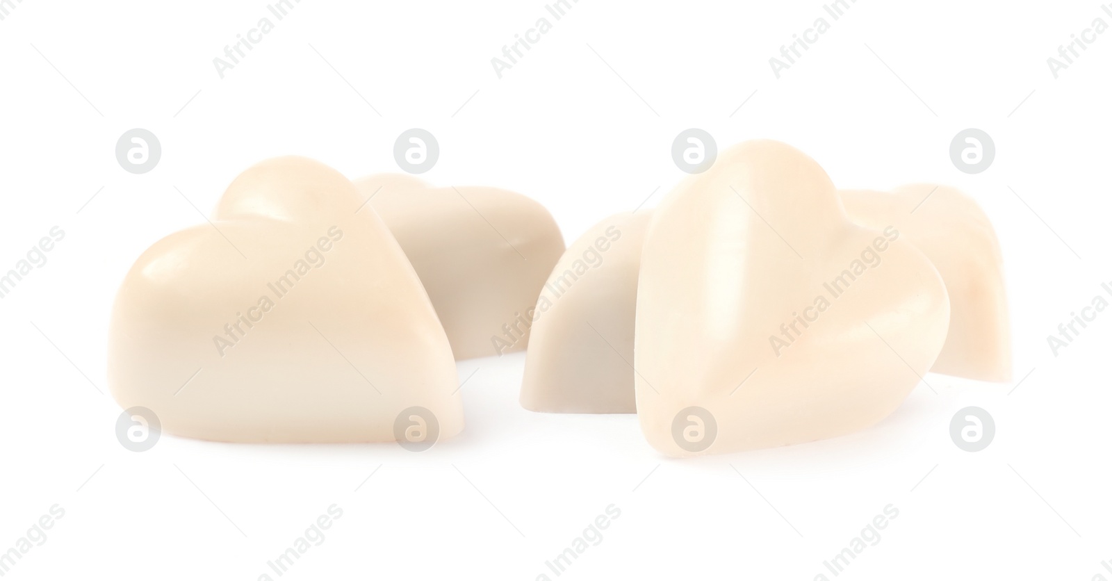 Photo of Beautiful heart shaped chocolate candies on white background