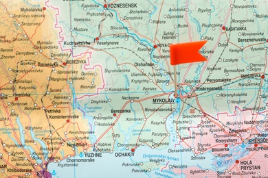 Photo of MYKOLAIV, UKRAINE - NOVEMBER 09, 2020: Mykolaiv city marked with push pin on map of Ukraine, closeup