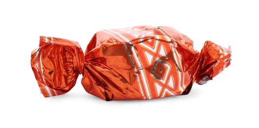 Candy in orange wrapper isolated on white