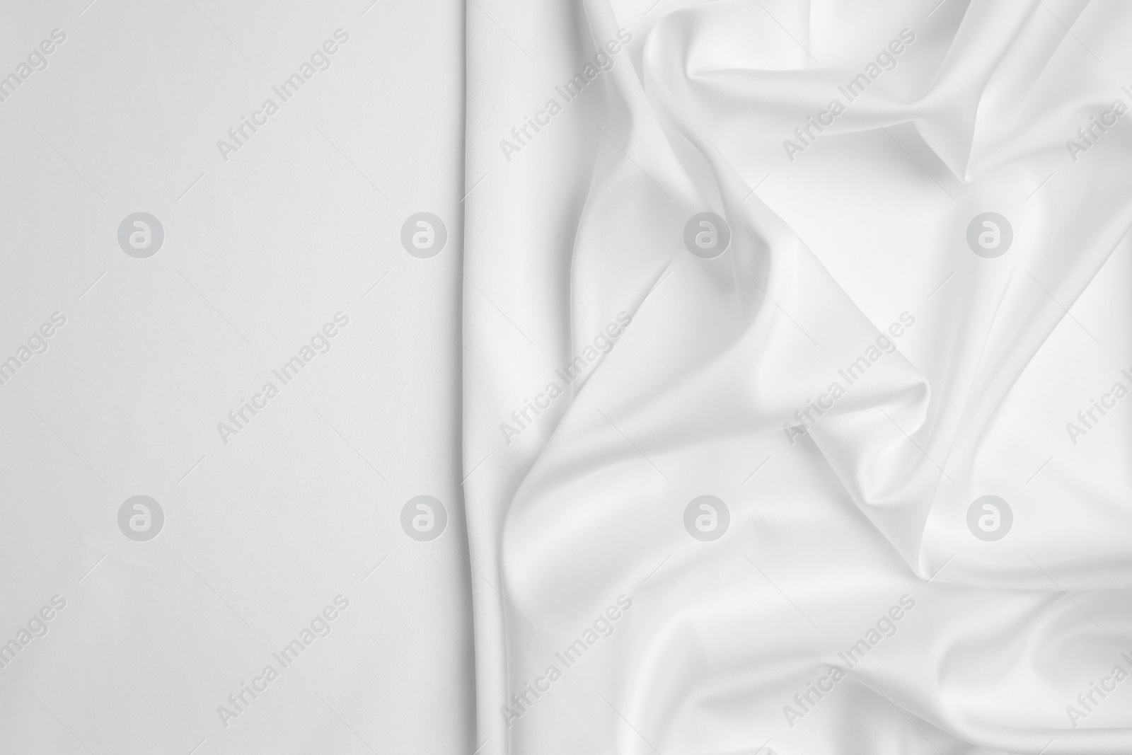 Photo of Texture of delicate fabric on white background, top view