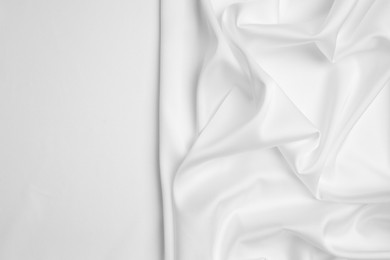 Photo of Texture of delicate fabric on white background, top view