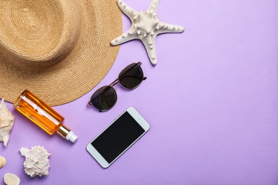 Photo of Flat lay composition with collection of beach objects on color background