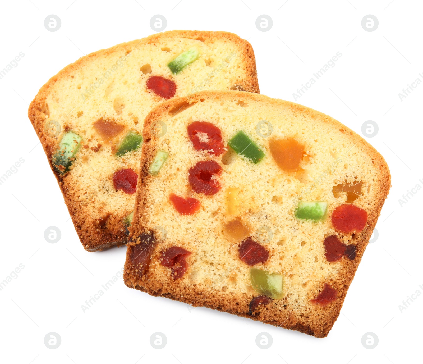 Photo of Slices of delicious cake with candied fruits on white background, top view