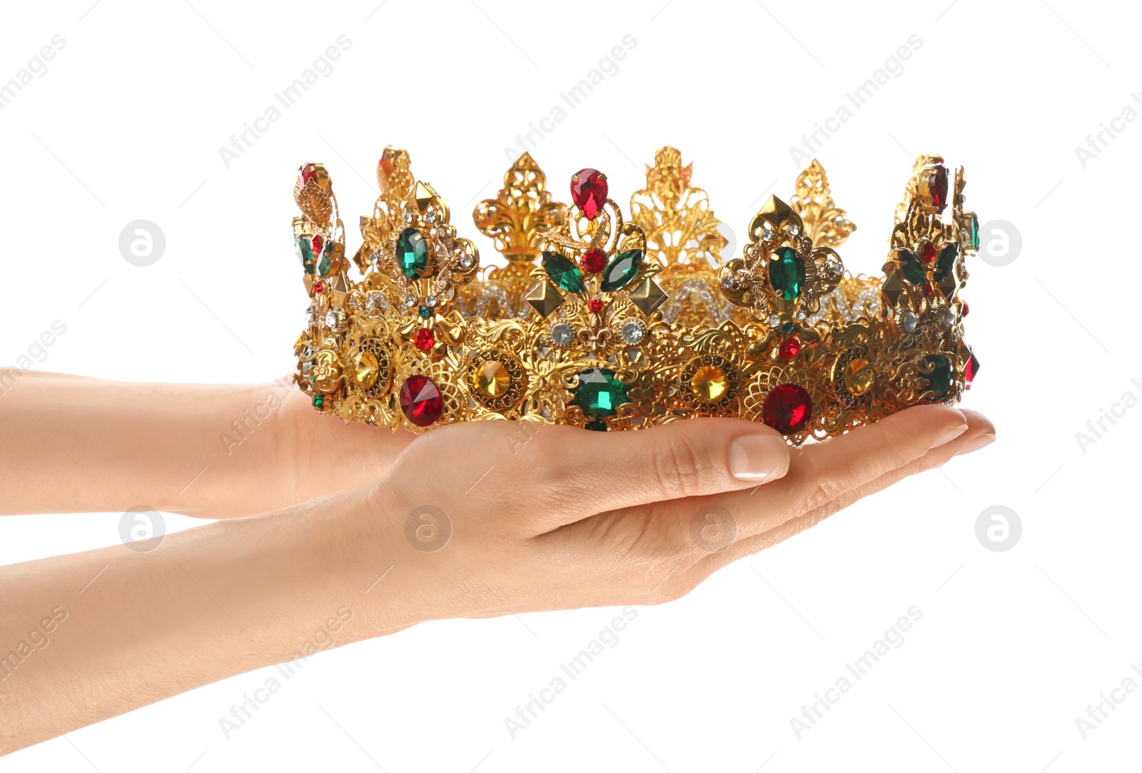 Photo of Woman holding beautiful golden crown on white background, closeup. Fantasy item