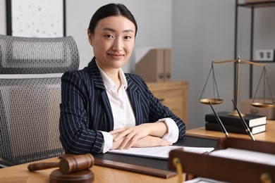 Portrait of notary at table in office