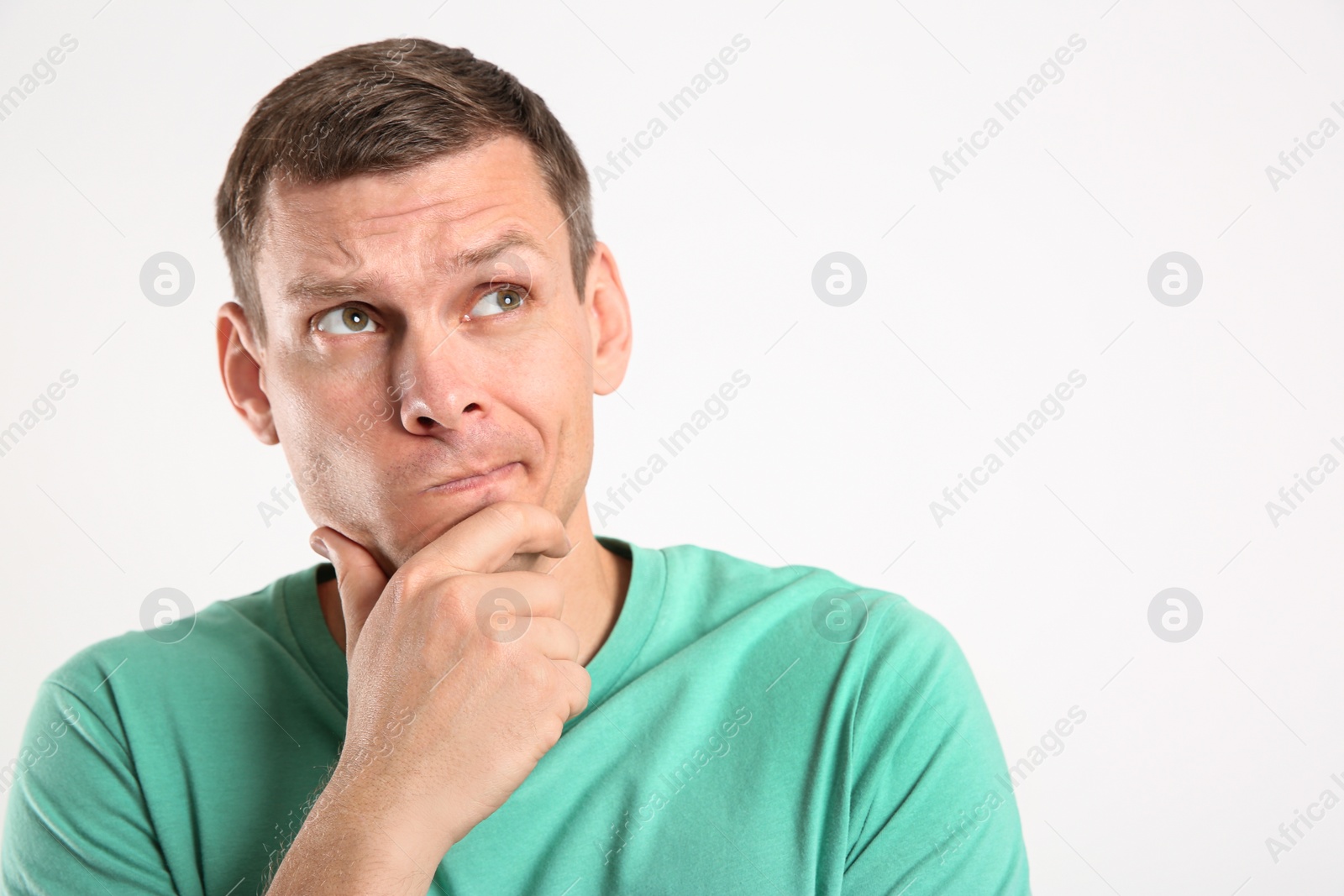 Photo of Emotional man in casual outfit on white background