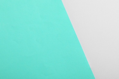 Photo of Turquoise and grey paper sheets as colorful background, top view