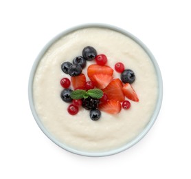 Photo of Delicious semolina pudding with berries isolated on white, top view