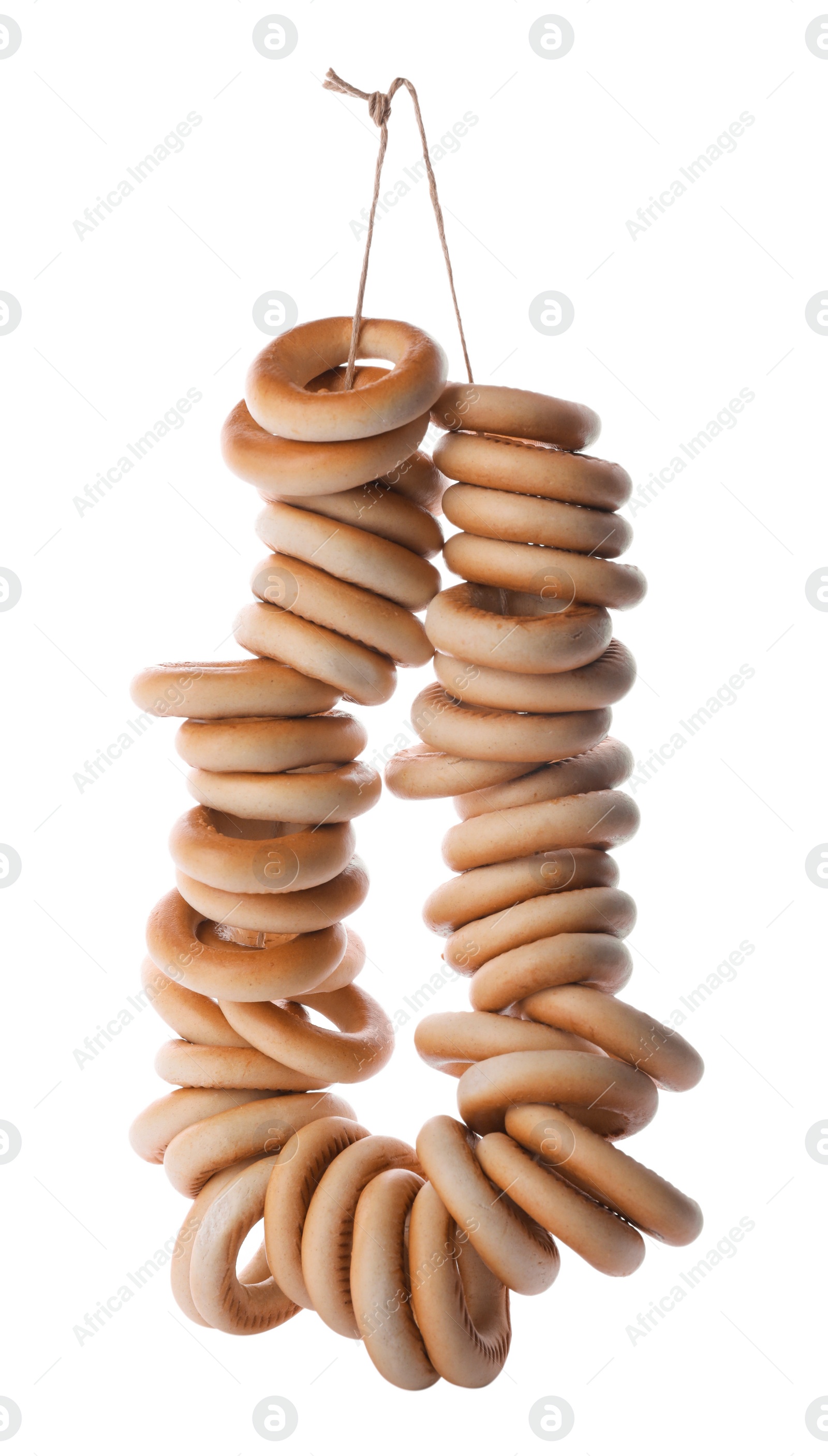 Photo of Bunch of delicious ring shaped Sushki (dry bagels) on white background