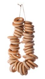 Bunch of delicious ring shaped Sushki (dry bagels) on white background