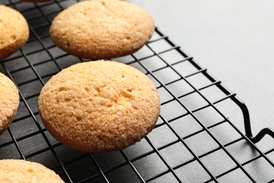 Baking grid with Danish butter cookies on table, closeup. Space for text