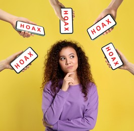 Image of Information hygiene. Thoughtful woman surrounded by hands holding smartphones with word Hoax on yellow background