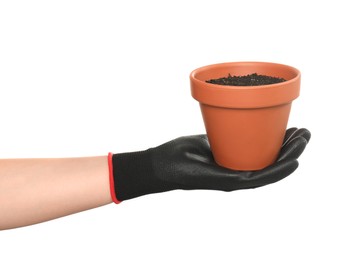 Photo of Woman holding terracotta flower pot filled with soil on white background, closeup