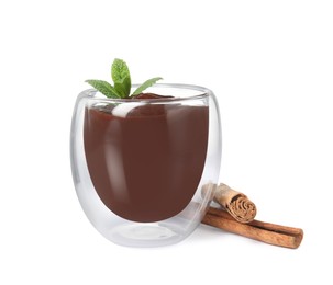 Glass of delicious hot chocolate with fresh mint and cinnamon sticks on white background