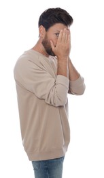 Photo of Embarrassed man covering face with hands on white background