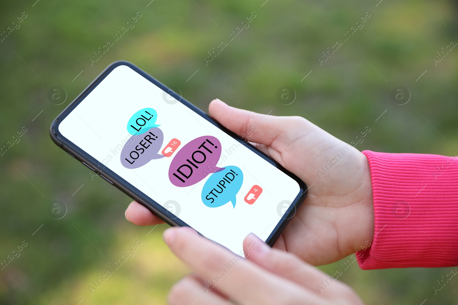 Image of Young woman holding smartphone outdoors, closeup. Cyber bullying concept 