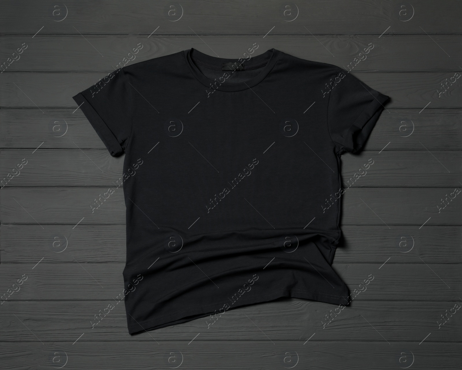 Photo of Stylish black T-shirt on gray wooden table, top view