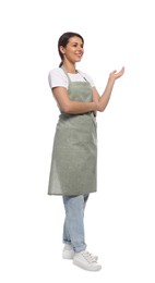 Photo of Young woman in green apron on white background