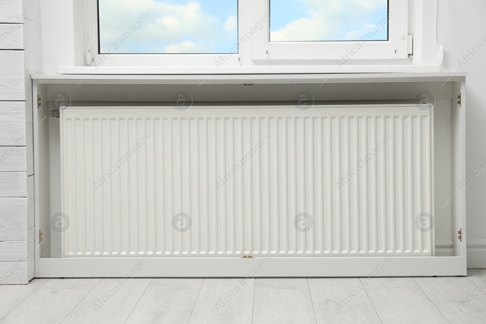 Photo of Modern radiator at home. Central heating system