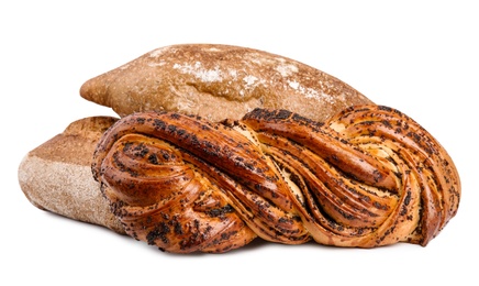 Loaves of fresh bread and pastry on white background