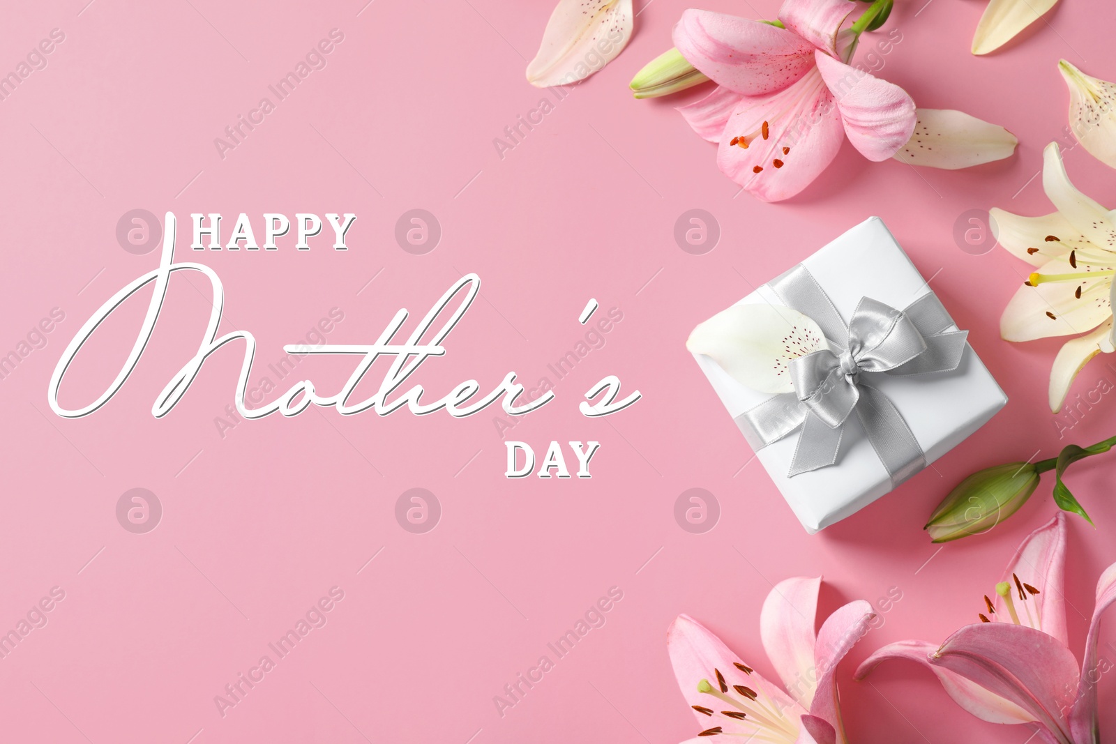 Image of Happy Mother's Day. Greeting card with beautiful lily flowers and gift box on pink background, flat lay