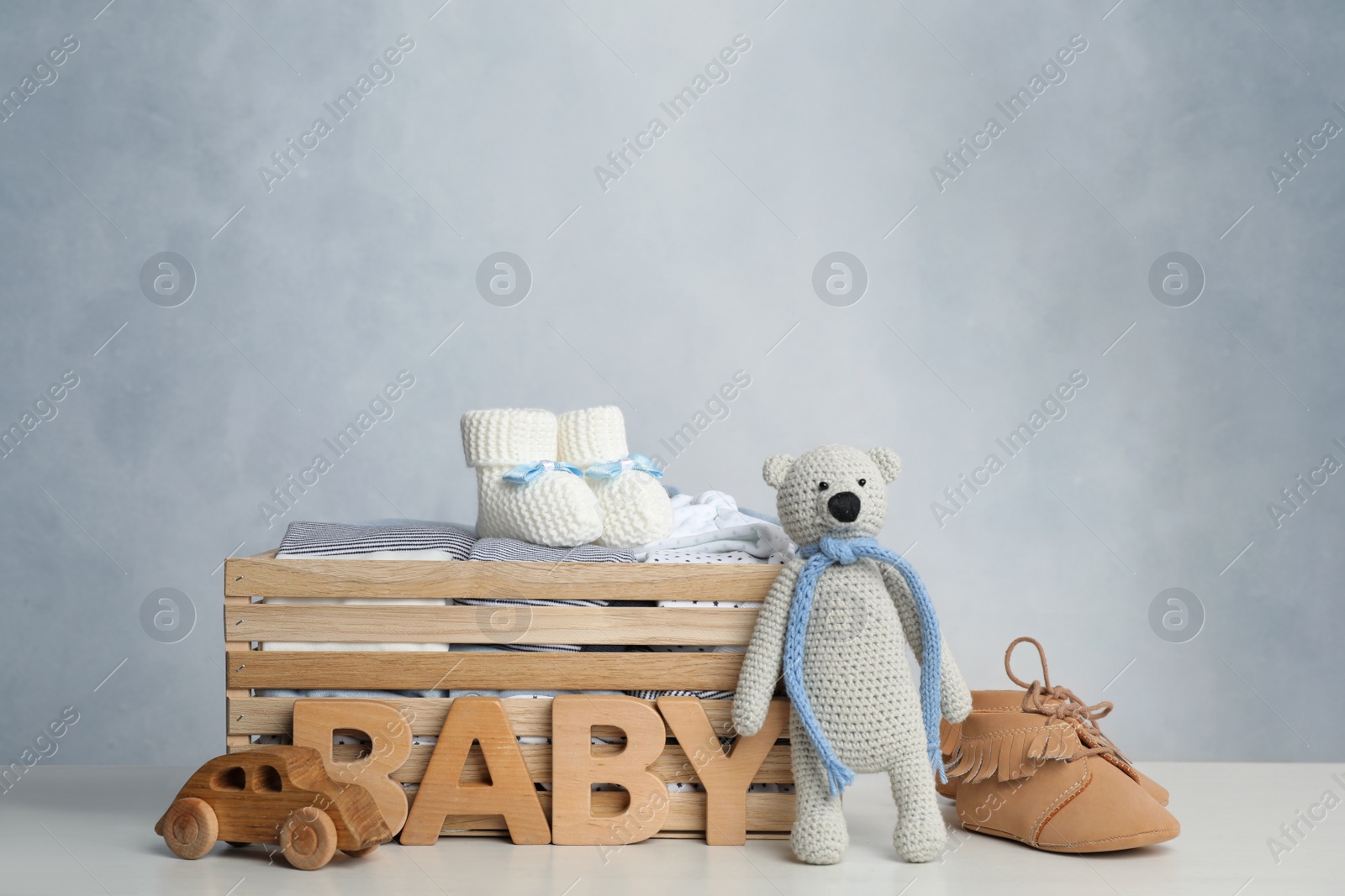 Photo of Composition with child's clothes on white table indoors