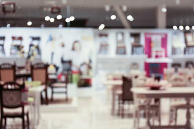 Photo of Blurred view of furniture store in mall. Bokeh effect