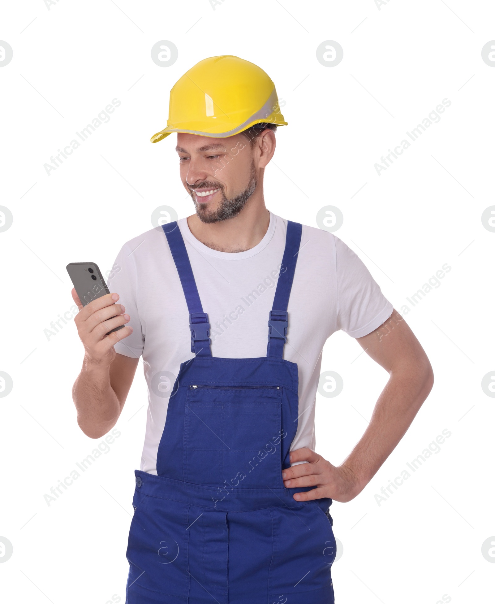 Photo of Professional repairman in uniform with phone on white background