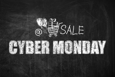 Illustration of  Text Cyber Monday Sale and picture of shopping cart on blackboard