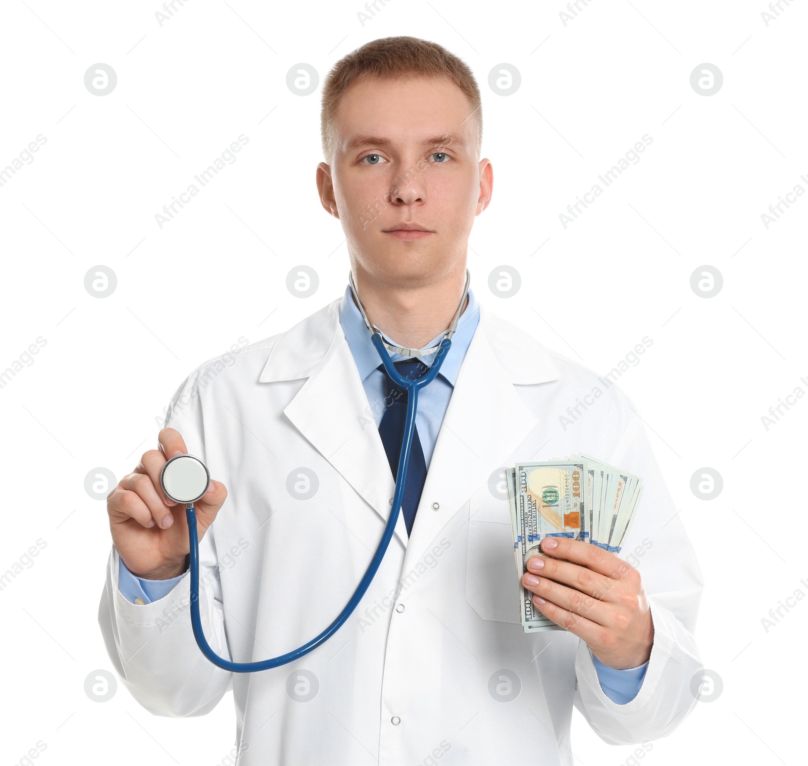 Photo of Doctor with bribe and stethoscope on white background. Corruption in medicine