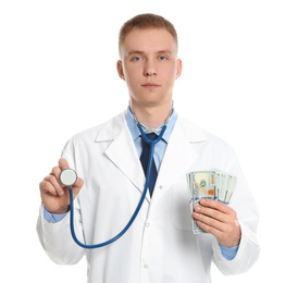 Doctor with bribe and stethoscope on white background. Corruption in medicine