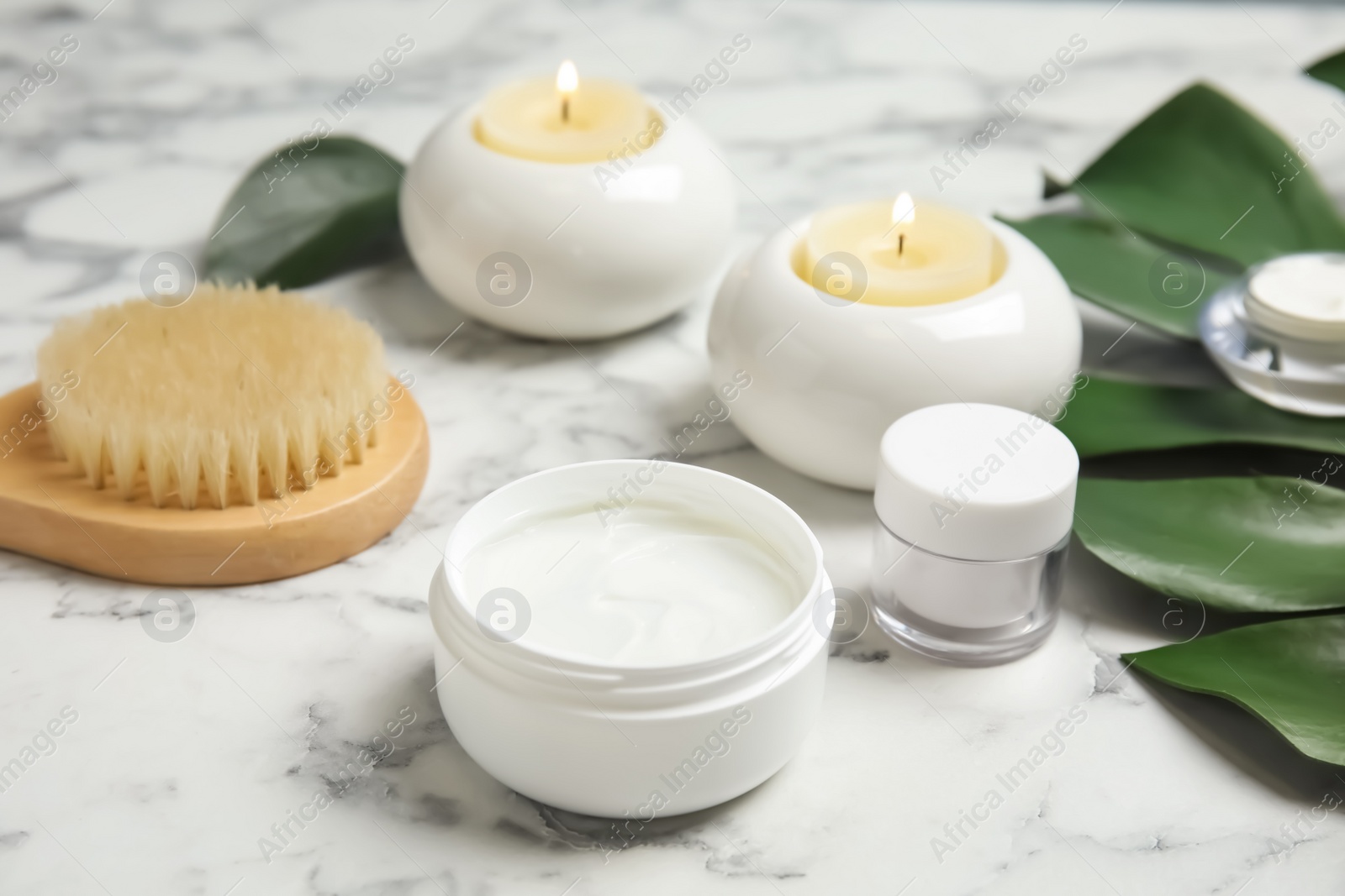 Photo of Composition with different body care products on marble table