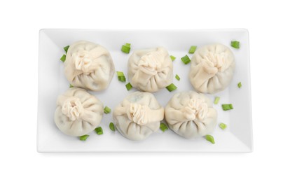 Photo of Plate with tasty fresh khinkali (dumplings) with onion isolated on white, top view. Georgian cuisine