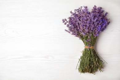 Photo of Lavender flowers on light background, top view
