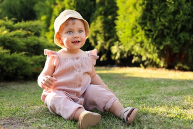 Photo of Cute little girl wearing stylish clothes outdoors on sunny day