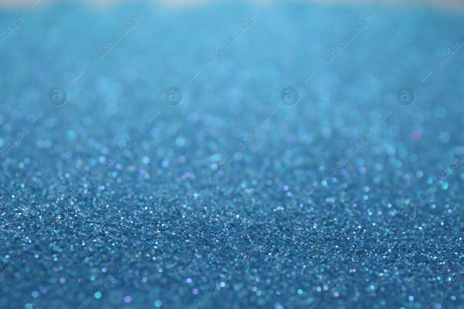 Photo of Shiny light blue glitter as background. Bokeh effect