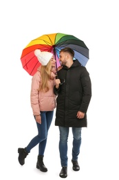 Full length portrait of beautiful couple with umbrella, isolated on white