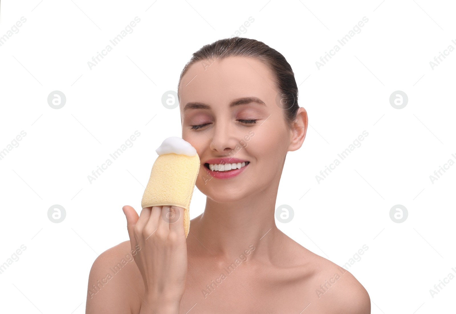 Photo of Happy young woman washing her face with sponge on white background