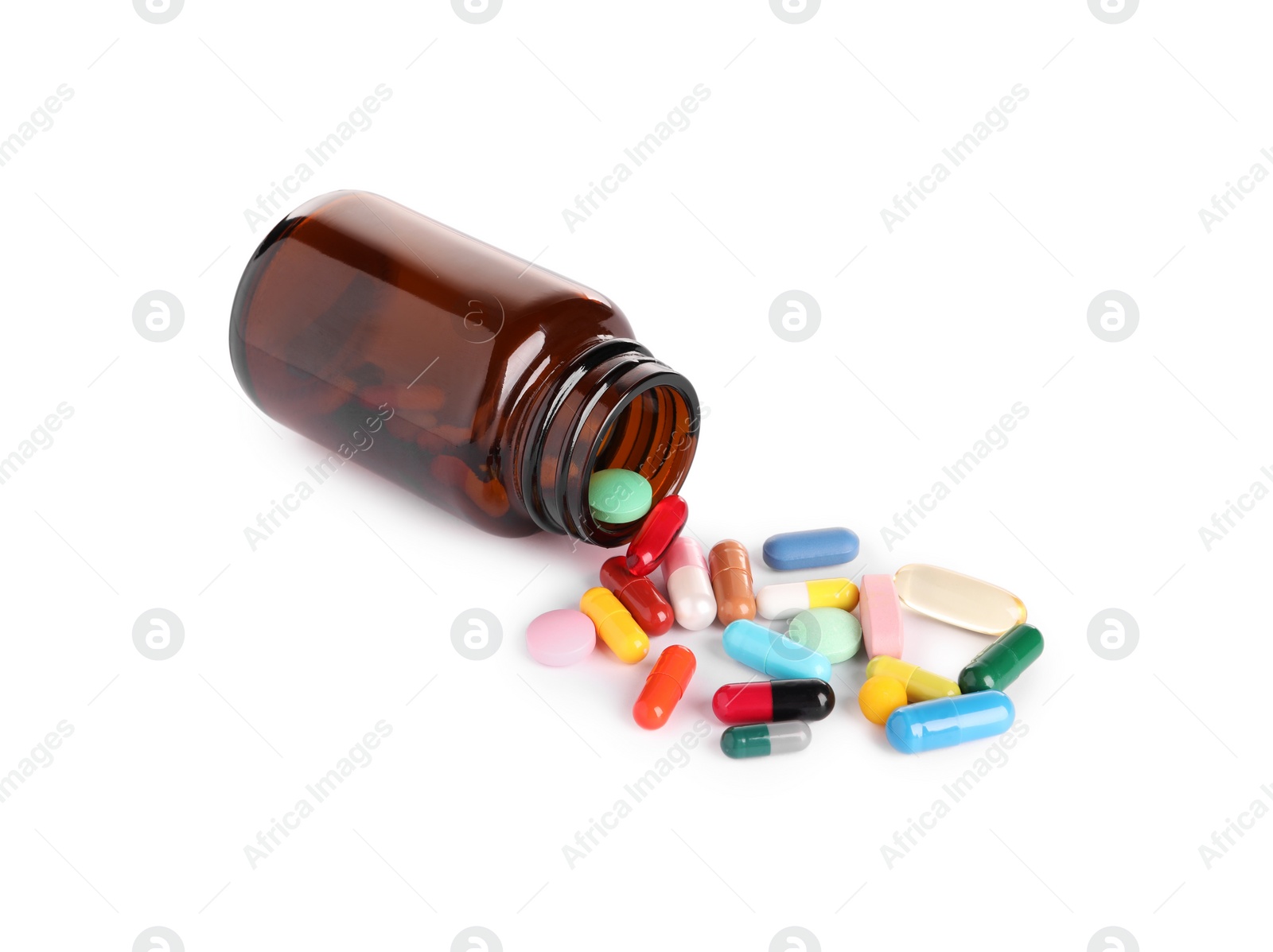 Photo of Plastic medical bottle with many different pills isolated on white