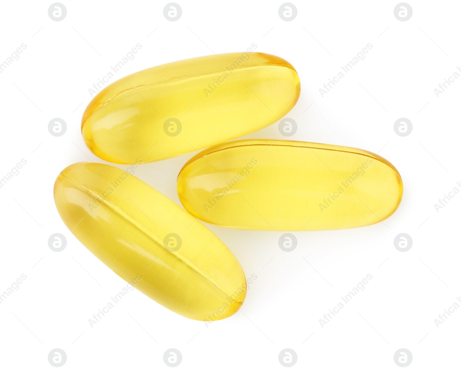 Photo of Many yellow vitamin capsules isolated on white, top view