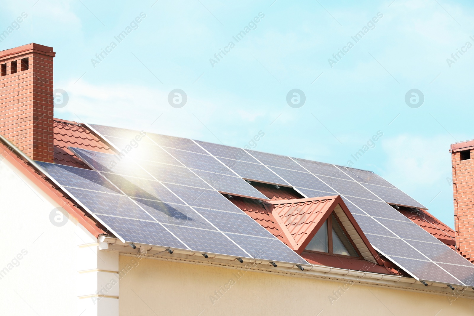 Photo of Building with installed solar panels on roof. Alternative energy source