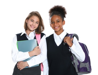 Photo of Happy girls in school uniform on white background