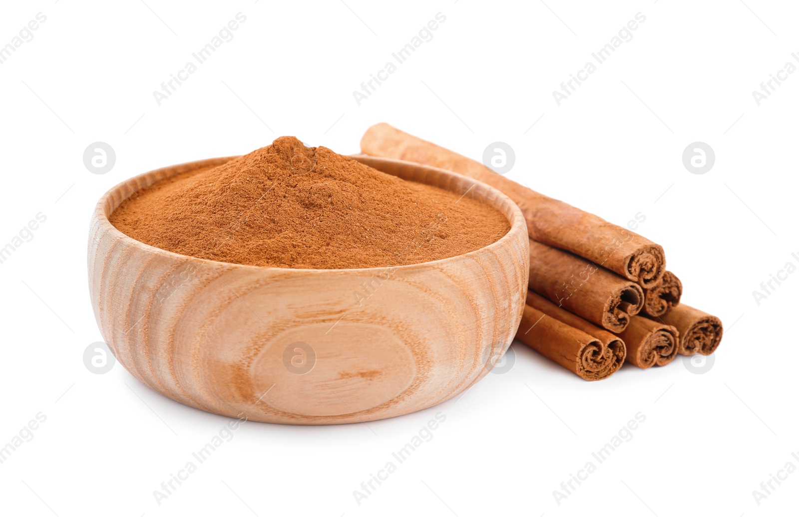 Photo of Aromatic cinnamon sticks and bowl with powder on white background