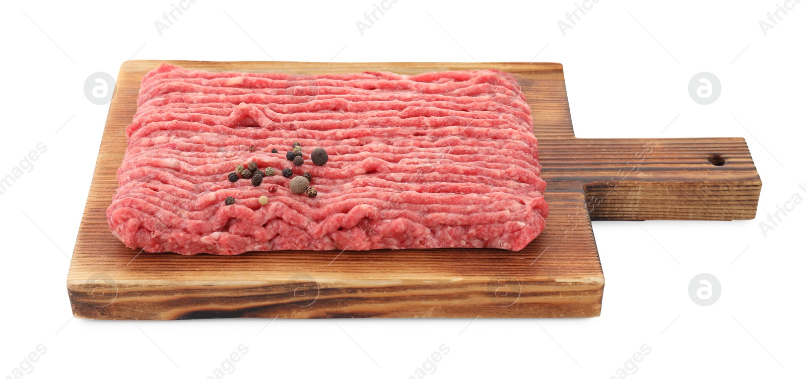 Photo of Board with raw ground meat and peppercorns isolated on white