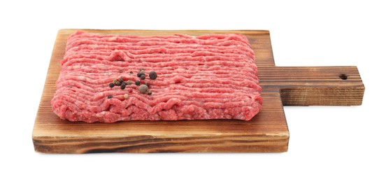 Board with raw ground meat and peppercorns isolated on white